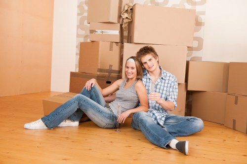 Mover using correct lifting technique during a house removal