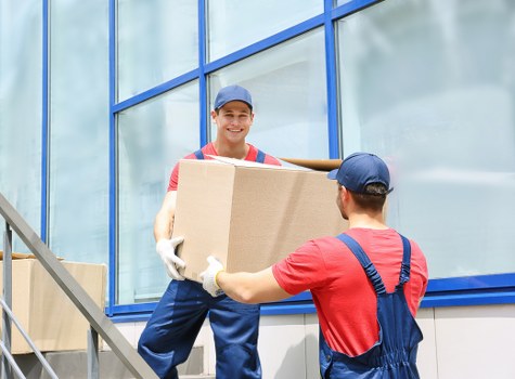 Specialist movers handling a piano removal in Richmond upon Thames