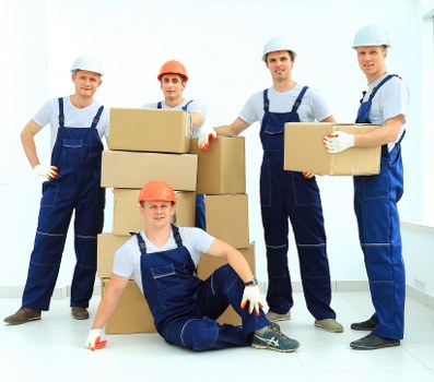 Professional movers loading furniture for a Richmonduponthames van service