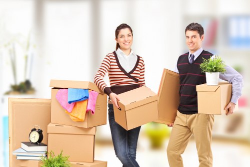 Professional movers carrying furniture during a Richmond upon Thames house removal