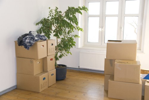 Supervisor checking safety procedures during a removals task