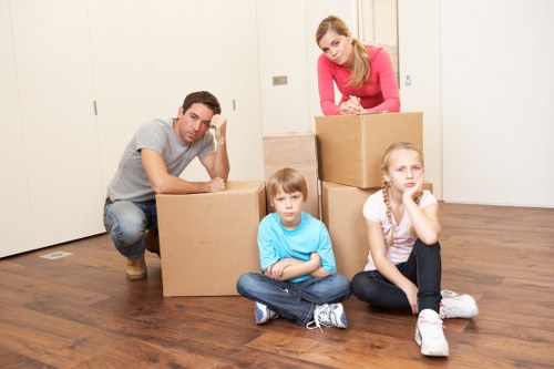 Removal team handling furniture during a house move