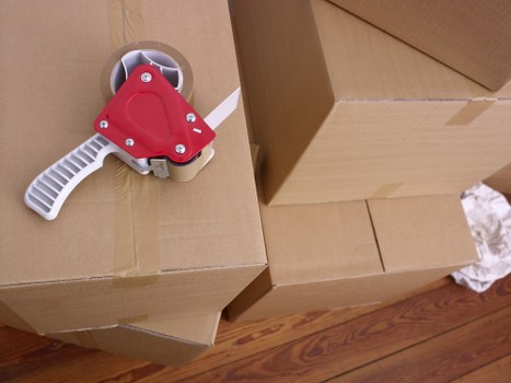 Packed moving boxes and furniture ready for house removal in Richmond upon Thames